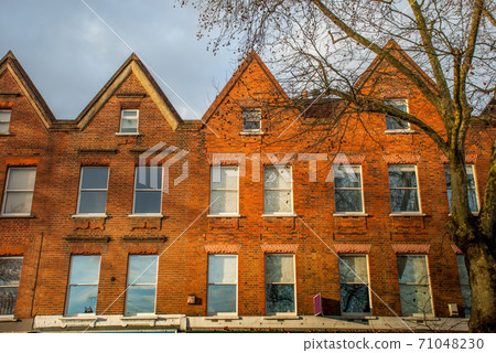 Beautiful brown stone townhouse with glass doors 71048230