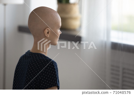 Close up rear view pensive hairless woman struggling with oncology 71048576