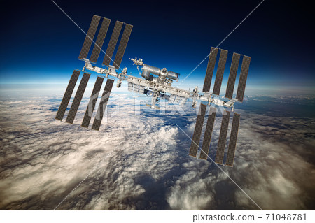 International Space Station over the planet earth. International Space Station over the planet earth. 71048781