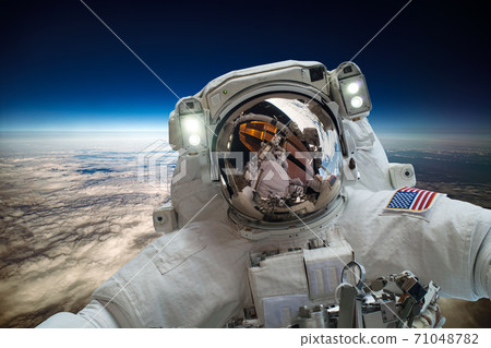 Astronaut in outer space against the backdrop  71048782