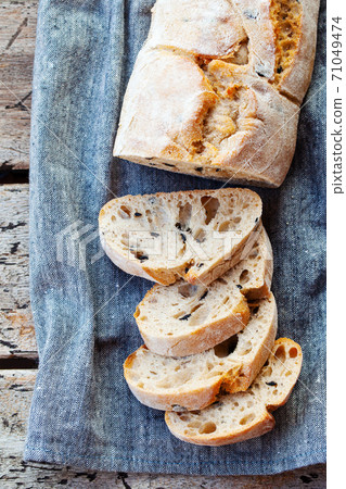 Ciabatta bread with olive branch. Wooden background. Close up. Top view. 71049474