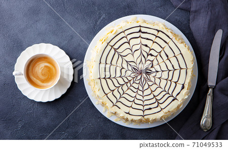 Traditional Hungarian Esterhazy cake, torte with cup of coffee. Grey background. Top view. 71049533