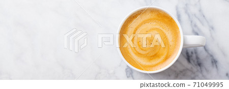 Coffee, espresso in white cup. Marble background. Copy space. Top view. Coffee, espresso in white cup. Marble background. Copy space. Top view. 71049995