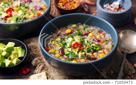 Vegetable quinoa soup, stew with avocado, corn, beans. South American traditional dish. Close up. 71050473