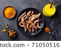 Fresh turmeric, curcuma, tumeric roots, dried slices, powder and golden milk. Grey background. Close up. Top view. 71050516