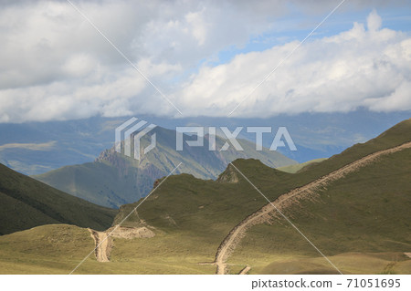 Panorama of road in mountains ofnational park Dombay, Caucasus Panorama of road in mountains ofnational park Dombay, Caucasus 71051695