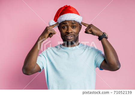African american man wearing Santa hat African american man wearing Santa hat 71052139