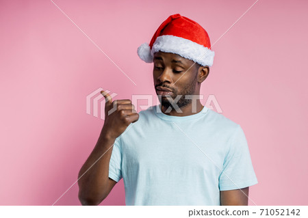 African american man wearing Santa hat African american man wearing Santa hat 71052142