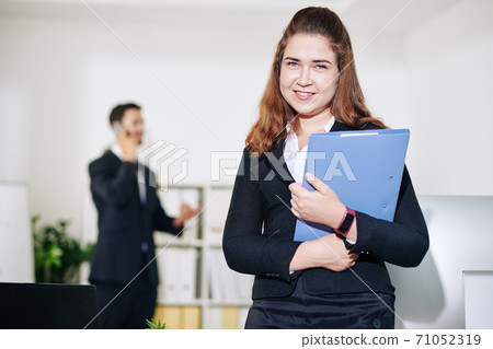 Female entrepreneur with folder Female entrepreneur with folder 71052319