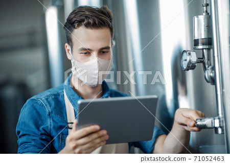 Work with production equipment in modern factory Work with production equipment in modern factory 71052463