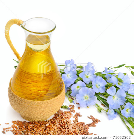 linseed oil, flaxseed and flowers isolated on a white 71052502