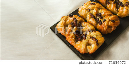 Danish pastry maple pecan with nuts and maple syrup.Space for text. banner. 71054972