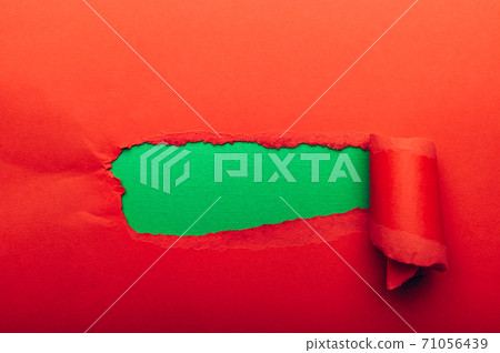 Red torn paper with green paper 71056439