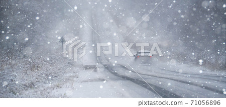 Car is driving on a winter road Car is driving on a winter road 71056896