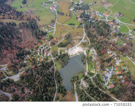 road in the autumn forest drone view 71058281