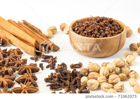 Assorted colorful spices on a white background. Assorted colorful spices on a white background. 71062073