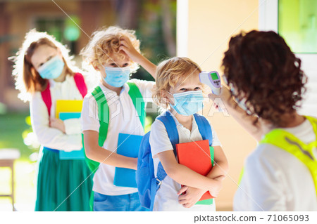 Temperature check at school. Child in mask. 71065093