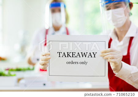 Food takeaway during coronavirus outbreak. 71065210