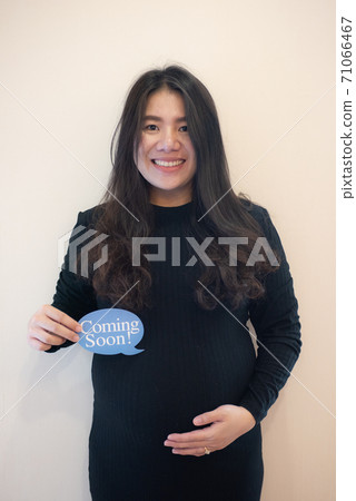 Pregnant woman feeling happy Pregnant woman feeling happy 71066467