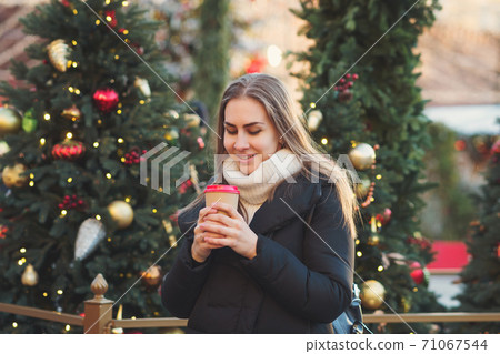 Girl walking at christmas market 71067544