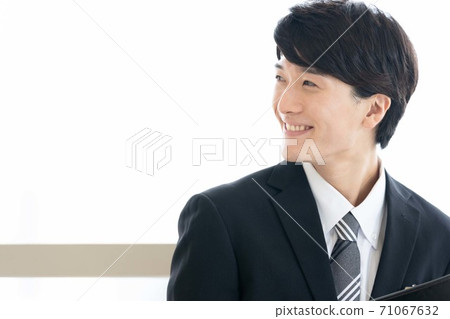 A young man in a suit A young man in a suit 71067632