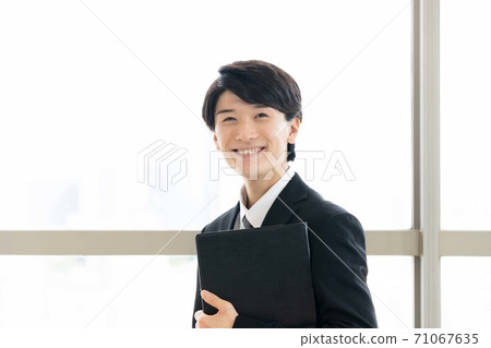 A young man in a suit A young man in a suit 71067635
