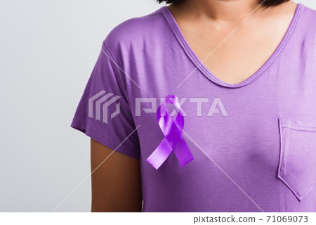 Young woman stick purple ribbon on the chest Young woman stick purple ribbon on the chest 71069073