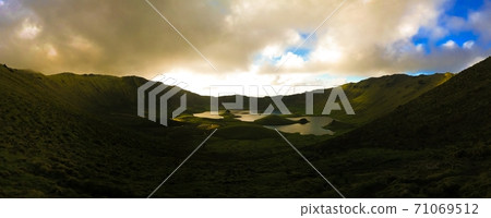 Landscape sunset view to Caldeirao crater, Corvo island, Azores, Portugal Landscape sunset view to Caldeirao crater, Corvo island, Azores, Portugal 71069512