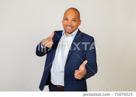 Portrait of a successful young African American businessman guy pointing his fingers at the camera 71070525