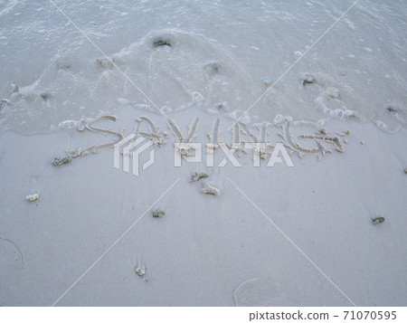 The letters saving were written on the sand with natural beauty The letters saving were written on the sand with natural beauty 71070595