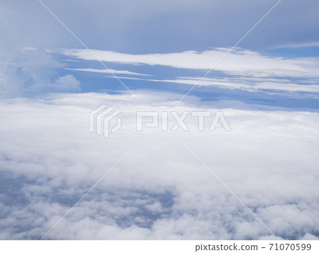 Clouds from airplane window with blue sky Clouds from airplane window with blue sky 71070599