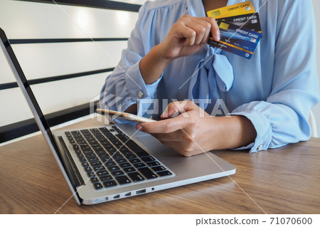 Business woman consumer spending via credit card and internet banking for shopping online Business woman consumer spending via credit card and internet banking for shopping online 71070600