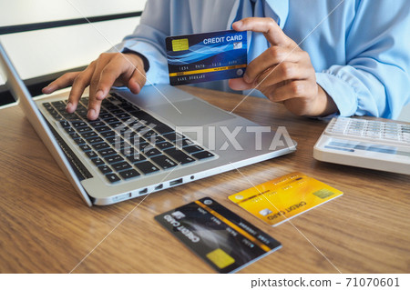 Business woman consumer spending via credit card and internet banking for shopping online Business woman consumer spending via credit card and internet banking for shopping online 71070601