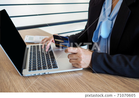 Business woman consumer spending via credit card and internet banking for shopping online Business woman consumer spending via credit card and internet banking for shopping online 71070605