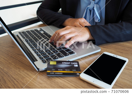 Business woman consumer spending via credit card and internet banking for shopping online 71070606