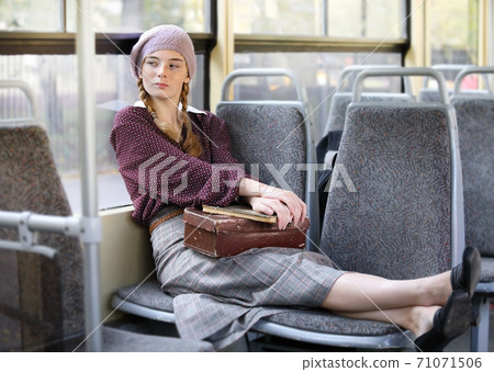 Young pretty student girl in city tram Young pretty student girl in city tram 71071506