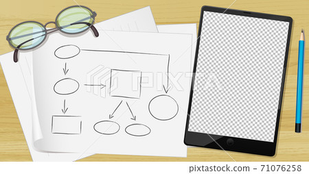 Tablet and paper on the table Tablet and paper on the table 71076258
