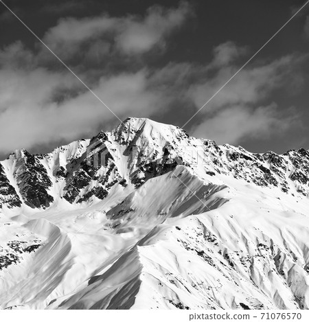 Black and white snow mountain peak at sunny day Black and white snow mountain peak at sunny day 71076570