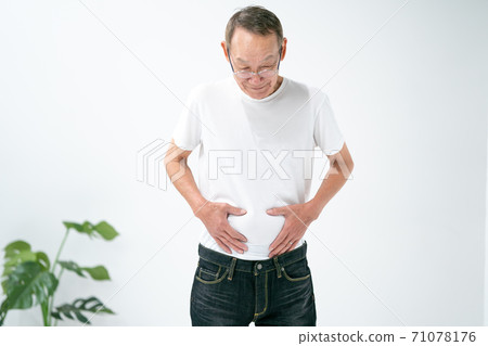 Senior man touching the belly Senior man touching the belly 71078176