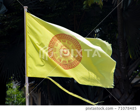 The dhammacakka flag, the symbol of Buddhism in Thailand flying in wind. 71078485