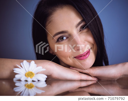 Portrait of smiling brunette woman looking at camera. Beauty concept Portrait of smiling brunette woman looking at camera. Beauty concept 71079792