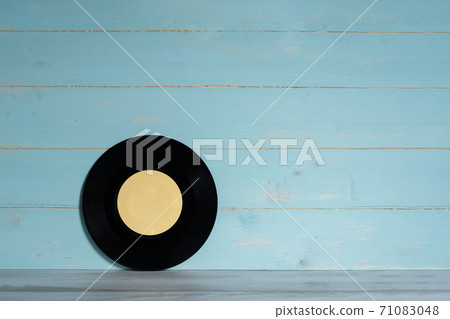 Vinyl record on blue wooden background 71083048