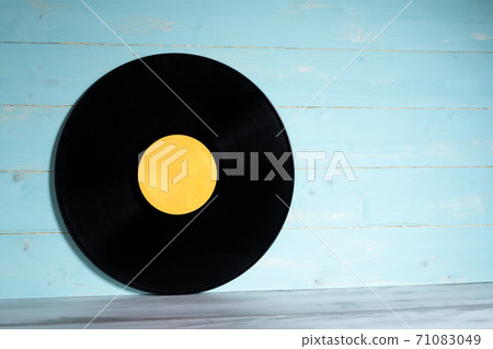 Vinyl record on blue wooden background 71083049