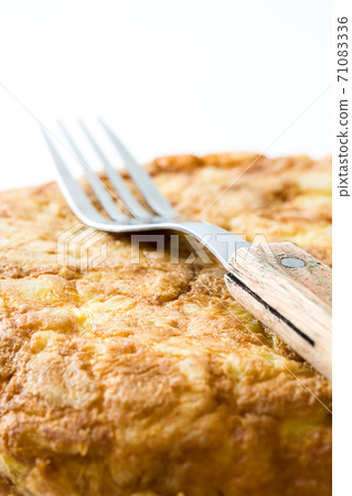 Traditional spanish omelette with potatoes and eggs isolated on white background Traditional spanish omelette with potatoes and eggs isolated on white background 71083336
