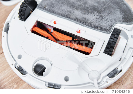 Repair robot vacuum cleaner, closeup. Household appliance service Repair robot vacuum cleaner, closeup. Household appliance service 71084246