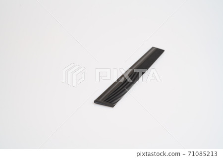 black comb with selective focus on light table 71085213