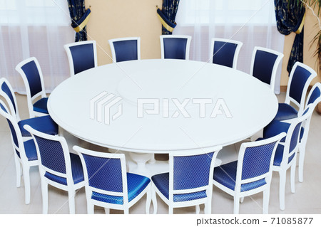 Empty white round conference table and chairs. Diplomatic background. Empty white round conference table and chairs. Diplomatic background. 71085877