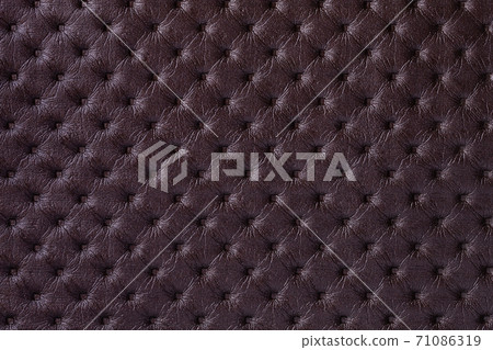 Texture of dark brown leather background with capitone pattern, macro. Texture of dark brown leather background with capitone pattern, macro. 71086319