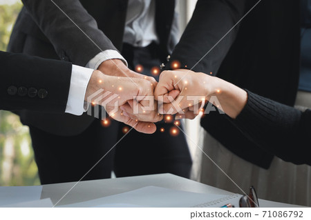 close up success business deal with doing fist bump of business people hands (teamwork or partnership concept) close up success business deal with doing fist bump of business people hands (teamwork or partnership concept) 71086792