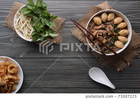 Closeup Thai boat noodle culture style top view and flat lay with copy space for advertising content Closeup Thai boat noodle culture style top view and flat lay with copy space for advertising content 71087223